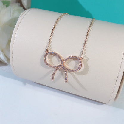 [Renovia Jewelry]CLAW SET RHODIUM PLATED BOW NECKLACE