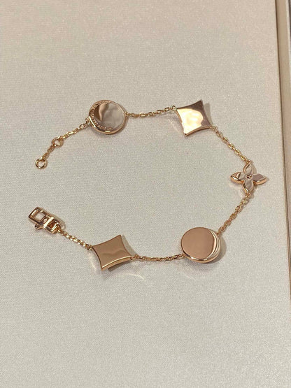 [Renovia Jewelry]STAR AND SUN 5 MOTIF MOP PINK GOLD BRACELET